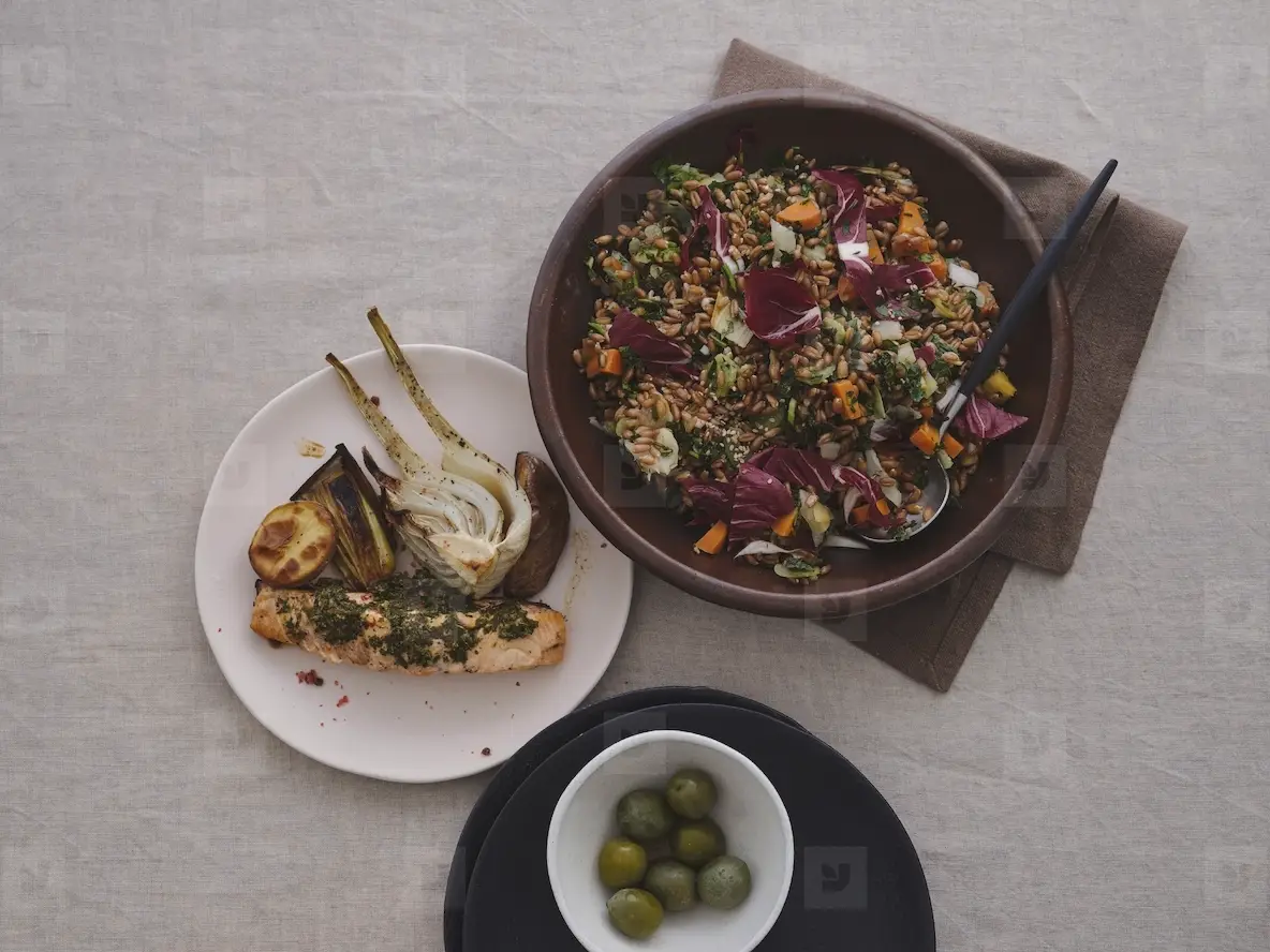 Still life view from above healthy  gourmet Mediterranean meal of spelt salad  grilled salmon