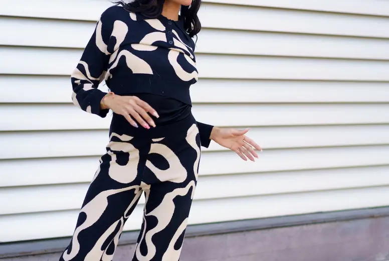 Hispanic modern dancer gesturing standing on street