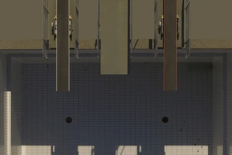 View from above diving platforms casting shadows over sunny