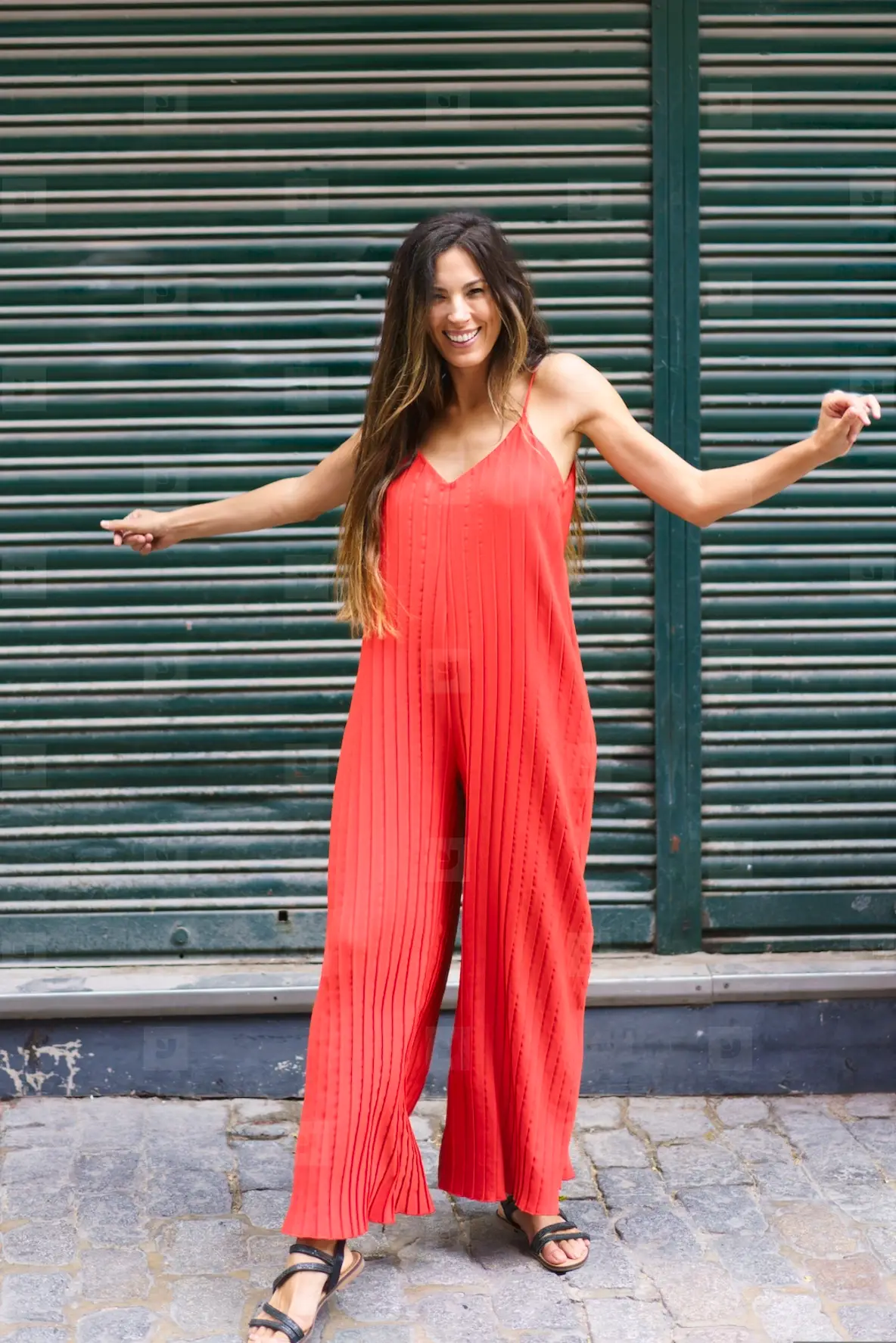A Stylish Woman Is Spotted On An Urban Street Wearing A Vibrant
