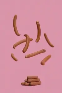 Bavarian sausages falling midair