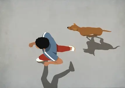 View from above man jogging with dog