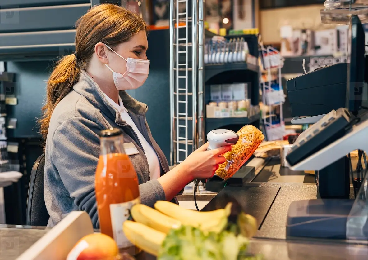 Female Cashier In Mask Using Barcode Scanner At Checkout Photo (312328 ...