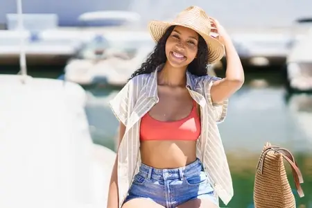 Bright and Cheerful Summer Vibes A Young Woman Enjoying Time by the Marina by the Water