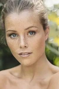 Close up portrait of beautiful young woman with bare shoulders