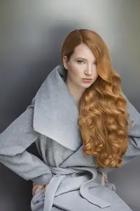 Studio portrait of beautiful stylish young woman with long