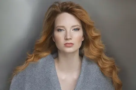 Formal portrait of beautiful young woman with wavy