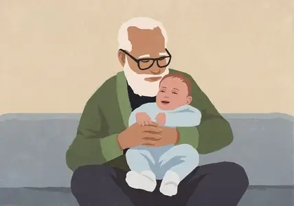 Affectionate grandfather holding baby grandson on sofa