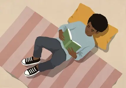 View from above of boy reading book