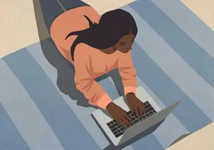 High angle view of woman laying on floor working at laptop