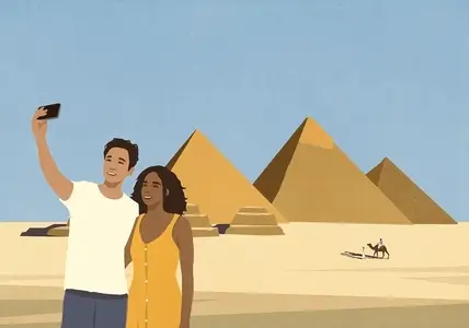 Happy young couple enjoying vacation taking selfie with Egyptian pyramids