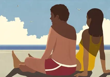 Shadow over couple relaxing on sunny summer ocean beach