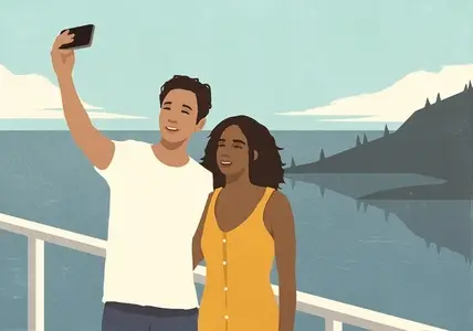 Happy young multiracial couple taking selfie on waterfront balcony overlooking scenic lake