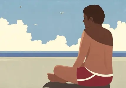 Shadow over sunburned man with bare chest sitting on sunny summer beach