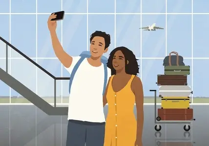 Happy young couple taking selfie in front of stacked luggage in airport concourse