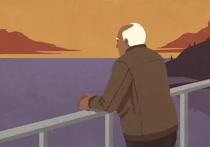 Senior man standing on balcony at waterfront enjoying beautiful orange and purple sunset view