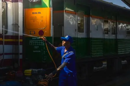 Bangkok  Thailand   March 3  Workers spray water to clean train