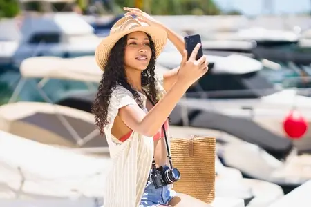 A Summer Selfie at the Beautiful Marina A Young Woman Enjoying a Fun Day Out with Friends