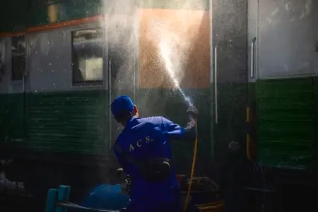 Bangkok  Thailand   March 3  Workers spray water to clean train