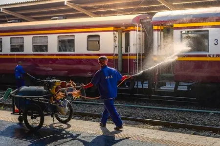 Bangkok  Thailand   March 3  Workers spray water to clean train