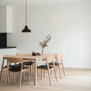 Scandinavian minimalism dining room with wooden table  black pendant light  cozy atmosphere