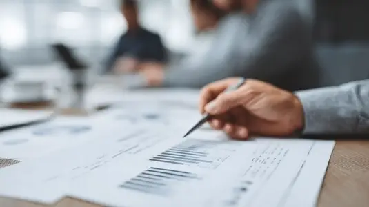 Financial document hand pen chart business office analysis report data