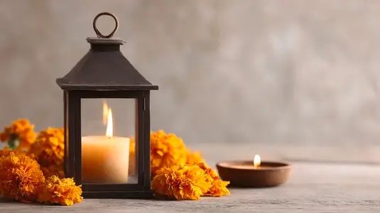 Lantern candle glowing marigold flower wooden table warm peaceful cozy decor