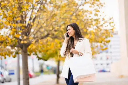 A Stylish Woman Enjoys Shopping in Trendy Fall Fashion and Accessories in Autumn Colors
