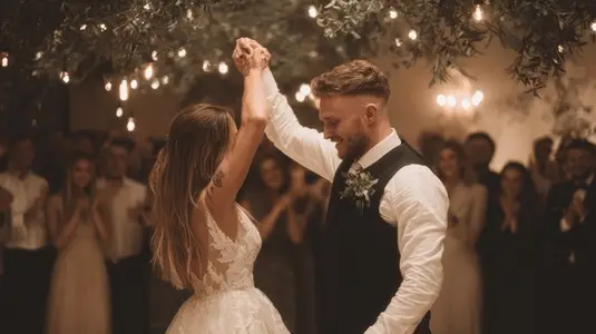 Wedding couple dancing with guests under fairy lights  romantic joyful celebration atmosphere