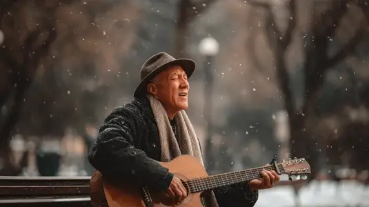 Elderly man playing acoustic guitar winter park snow falling joyful music outdoor performance