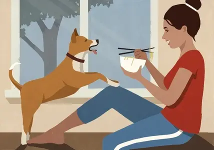 Playful dog jumping on happy woman eating noodles at window
