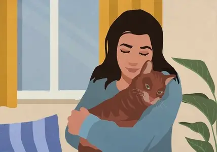 Serene affectionate woman cuddling with pet cat at home