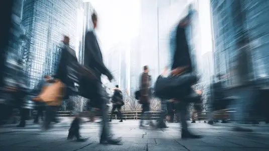 Urban environment with blurred motion of people walking in business district  showcasing dynamic city life