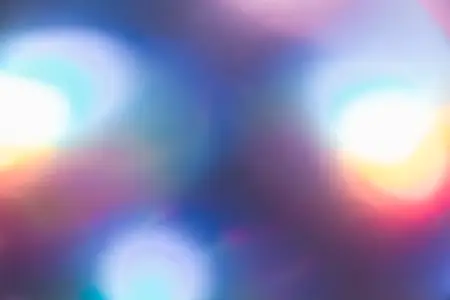 Soft colorful abstract background with blurred light reflections in purple  blue  and pink tones  creating a dreamy gradient texture