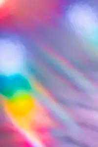 Soft colorful abstract background with blurred light reflections in purple  blue  and pink tones  creating a dreamy gradient texture