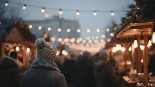 Cozy Christmas market scene with wooden stalls  twinkling lights  and crowd enjoying festive atmosphere