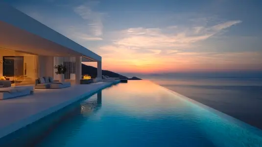 Modern architecture villa with infinity pool  sunset view  serene atmosphere  luxurious design  coastal landscape