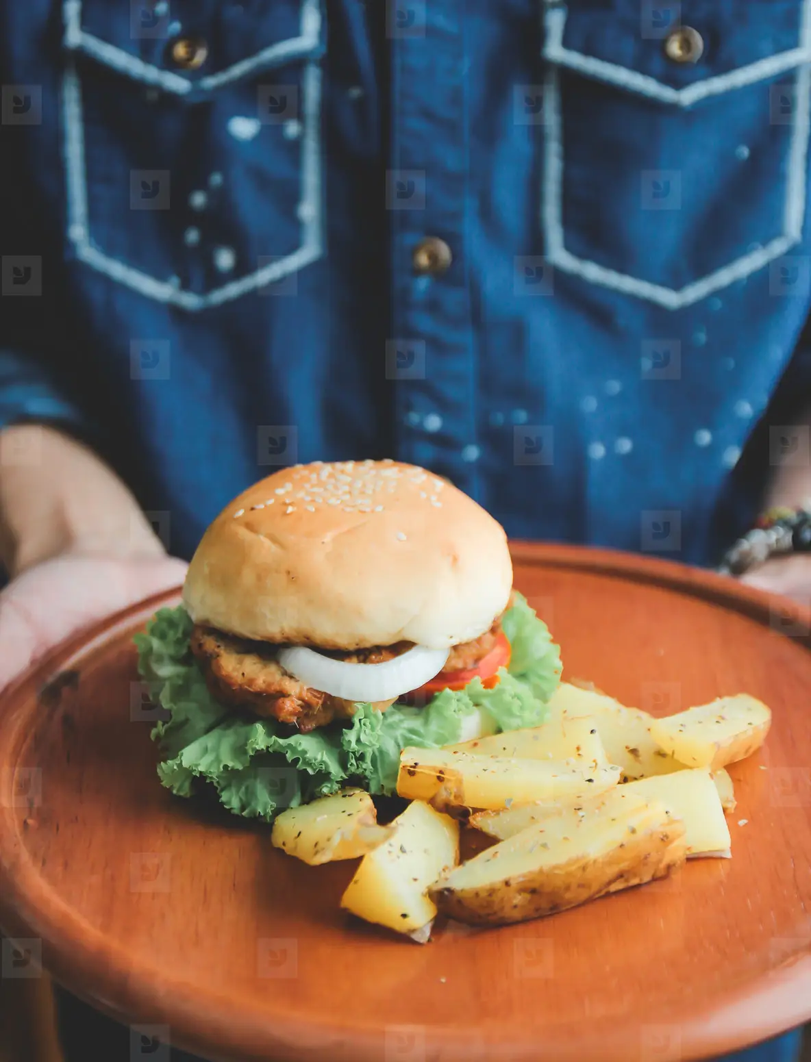 Man holding tasty burger