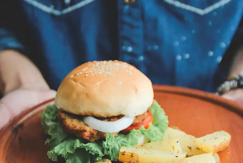 Man holding tasty burger